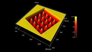 Magnesium oxide (MgO) crystal, carved in a Focused Ion Beam (FIB) system. The top, unaltered surface shows single and double atomic steps.