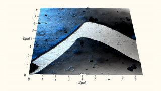 Crack in a carbon layer deposited on a glass substrate