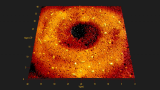 Central region of a self-organized Archimedean spiral pattern in a colloidal carbon film on glass. Sample provided by Dr. K. Shtarbova.