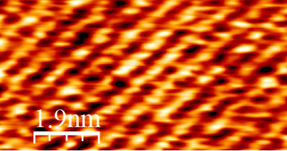 Interface analysis between a model for the graphite electrode and solvent for electrolytes of lithium-ion batteries.
An example of the interface observation between highly oriented pyrolytic graphite (HOPG) as a model for graphite electrodes and tetraglyme, which has been studied as a solvent of electrolytes for lithium ion batteries. 
The AFM cantilever oscillation frequency and amplitude during the experiments were 92 kHz and 0.3 nm, respectively. The temperature was maintained at 298 K under an argon atmosphere throughout the experiment to prevent the dissolution of contaminants from the air, which could affect the interface structure. The topographic image revealed an ordered structure at Δf = 1000 Hz, obtained with tetraglyme adsorbed on an HOPG surface.